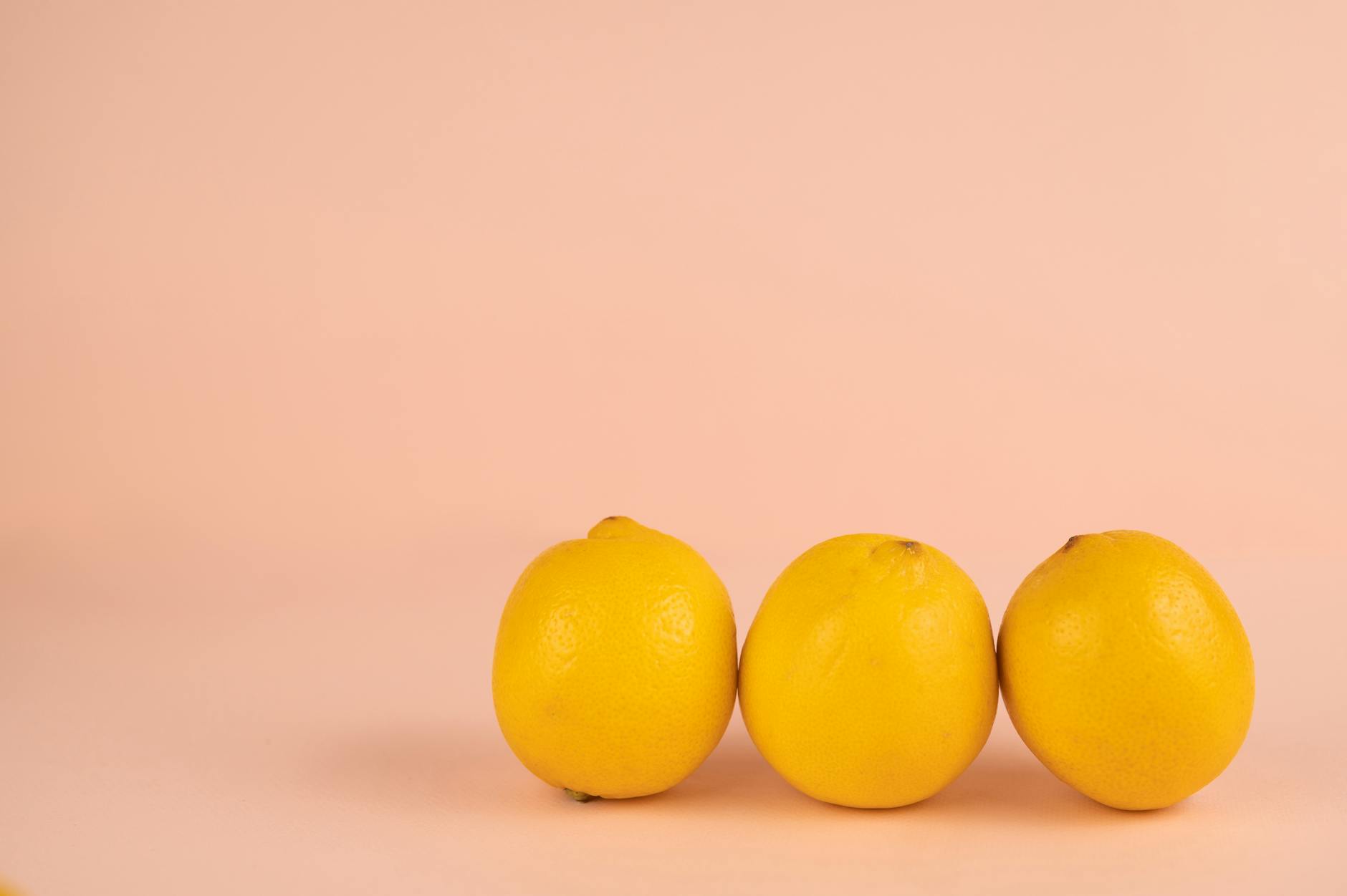 Bright ripe lemons on a pastel background