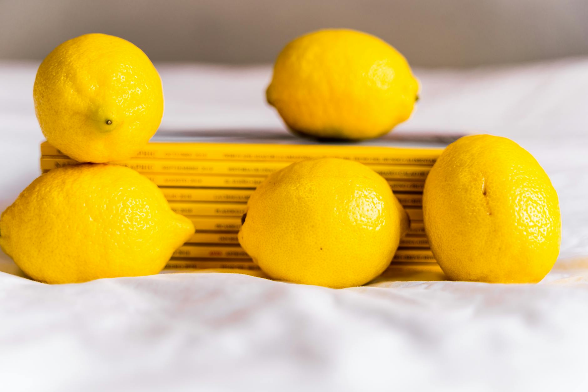 Fresh lemons arranged artfully with books, symbolizing natural comfort and ease in rebuilding intimacy